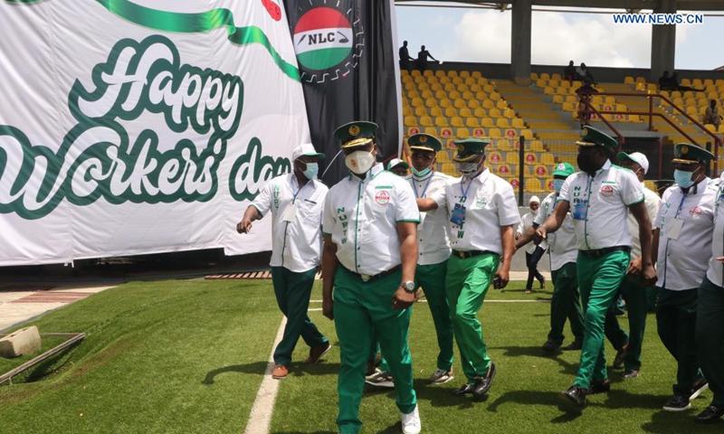 People parade at an event celebrating the International Workers' Day in Lagos, Nigeria, on May 1, 2021. (Photo by Emma Houston/Xinhua)