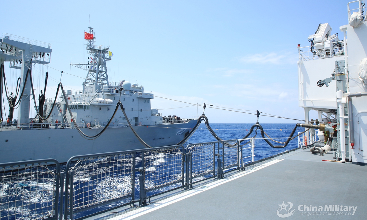 Naval vessels attached to an auxiliary ship group under the PLA Southern Theater Command perform alongside liquid cargo replenishment-at-sea during a maritime training exercise in mid- April, 2021.  Photo: China Military Online