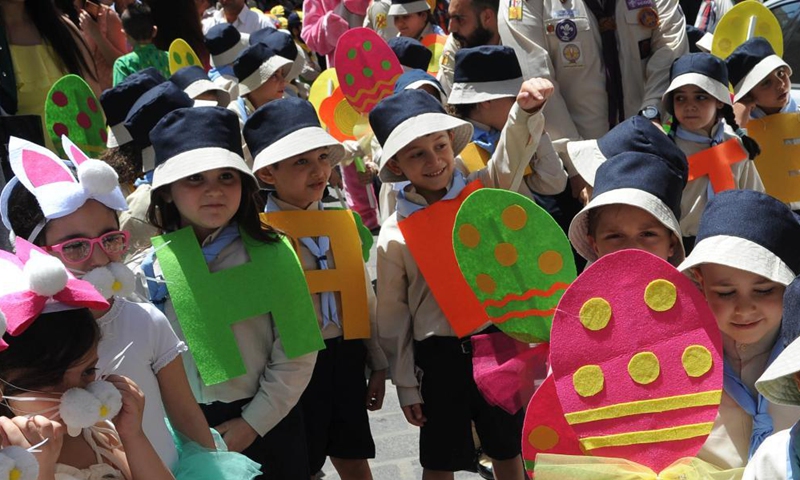 Children are seen during the Easter celebrations east of Damascus, Syria, on May 2, 2021. (Photo by Ammar Safarjalani/Xinhua)