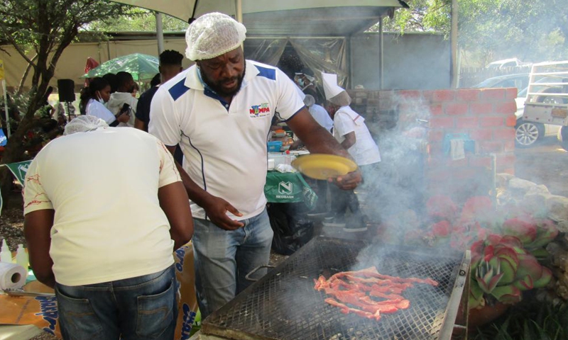 Participants prepare their dishes at the official launch of a nationwide annual Kapana cook-off in Windhoek, Namibia, on May 7, 2021. Namibia hosted the event on Friday in search of Namibia's best Kapana cooks in the country. Kapana is a way of preparing raw meat, typically beef by grilling it on an open fire.Photo:Xinhua