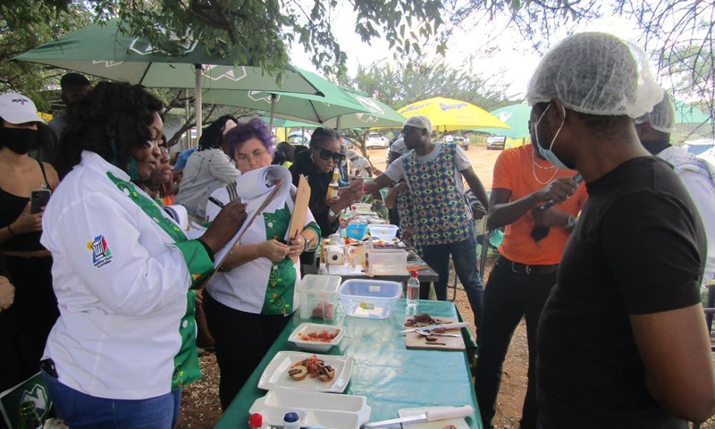 A culinary judge takes notes at the official launch of a nationwide annual Kapana cook-off in Windhoek, Namibia, on May 7, 2021. Namibia hosted the event on Friday in search of Namibia's best Kapana cooks in the country. Kapana is a way of preparing raw meat, typically beef by grilling it on an open fire. Photo:Xinhua