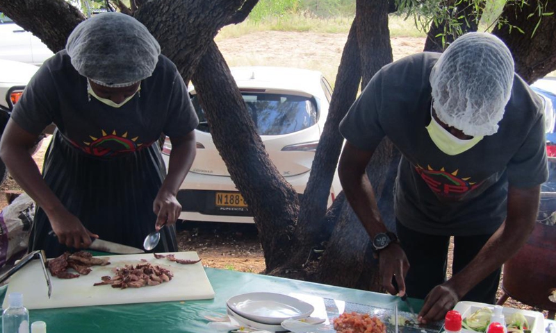 Participants prepare their dishes at the official launch of a nationwide annual Kapana cook-off in Windhoek, Namibia, on May 7, 2021. Namibia hosted the event on Friday in search of Namibia's best Kapana cooks in the country. Kapana is a way of preparing raw meat, typically beef by grilling it on an open fire. Photo:Xinhua