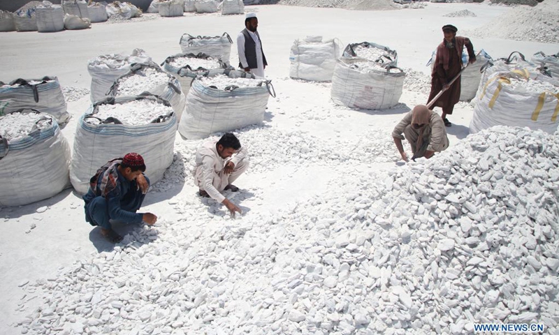 People work at a talc stone processing factory in Sorkh Road district of Nangarhar province, Afghanistan, on May 9, 2021. Afghanistan has resumed the export of talc stone from a key mine in the country's eastern province of Nangarhar, the Ministry of Industry and Commerce said on Sunday.(Photo: Xinhua)