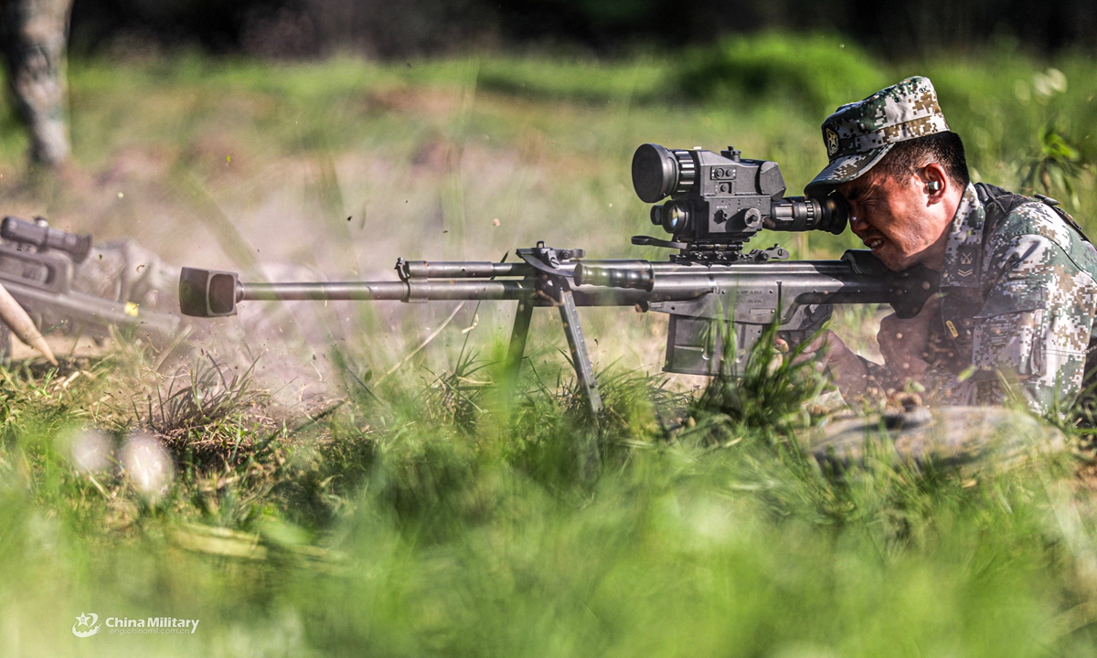 Snipers assigned to a brigade under the PLA 72nd Group Army aim their sniper rifles at targets during a live fire assessment on April 26, 2021.Photo:China Military