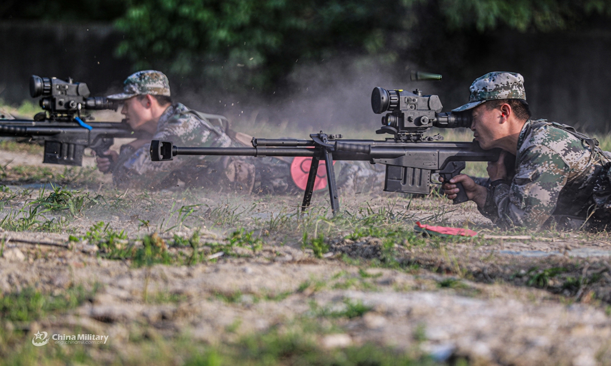 Snipers assigned to a brigade under the PLA 72nd Group Army aim their sniper rifles at targets during a live fire assessment on April 26, 2021.Photo:China Military