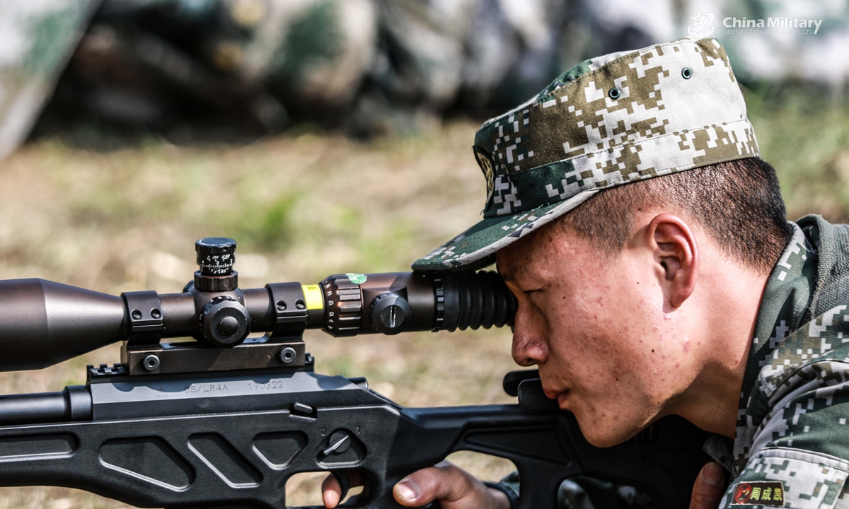 Snipers assigned to a brigade under the PLA 72nd Group Army aim their sniper rifles at targets during a live fire assessment on April 26, 2021.Photo:China Military