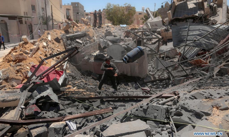 A Palestinian inspects the rubble of a house destroyed by Israeli airstrikes, in Khan Younis refugee camp in the southern Gaza Strip, May 15, 2021.(Photo: Xinhua)