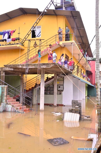 An inundated building is seen in flood in Gampaha, Sri Lanka, May 15, 2021. At least four people had died and over 42,000 others had been affected by days of strong winds and heavy rains which lashed the country due to the formation of a super cyclone in the Bay of Bengal, Sri Lanka's Disaster Management Center (DMC) said in its latest weather report Saturday.(Photo: Xinhua)