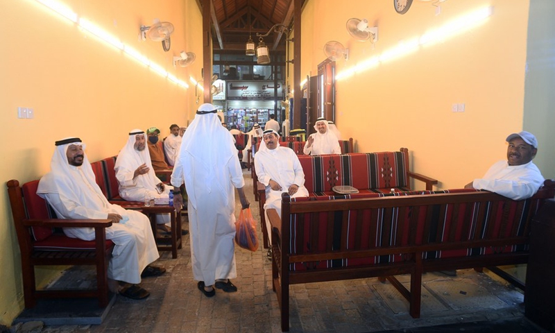 Customers sit in a cafe at the Al-Mubarakiya market in Kuwait City, Kuwait, May 23, 2021.(Photo: Xinhua)