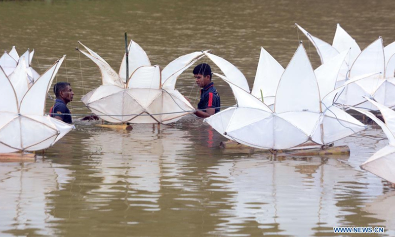 People install lantern decorations for the Vesak festival in Colombo, Sri Lanka, on May 26, 2021. The Vesak festival is one of the holiest festivals celebrated in Sri Lanka as it marks the birth, enlightenment and demise of Lord Buddha.(Photo: Xinhua)