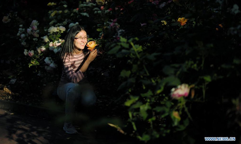 A woman poses for photo at a park in San Mateo, California, the United States, May 28, 2021.Photo:Xinhua