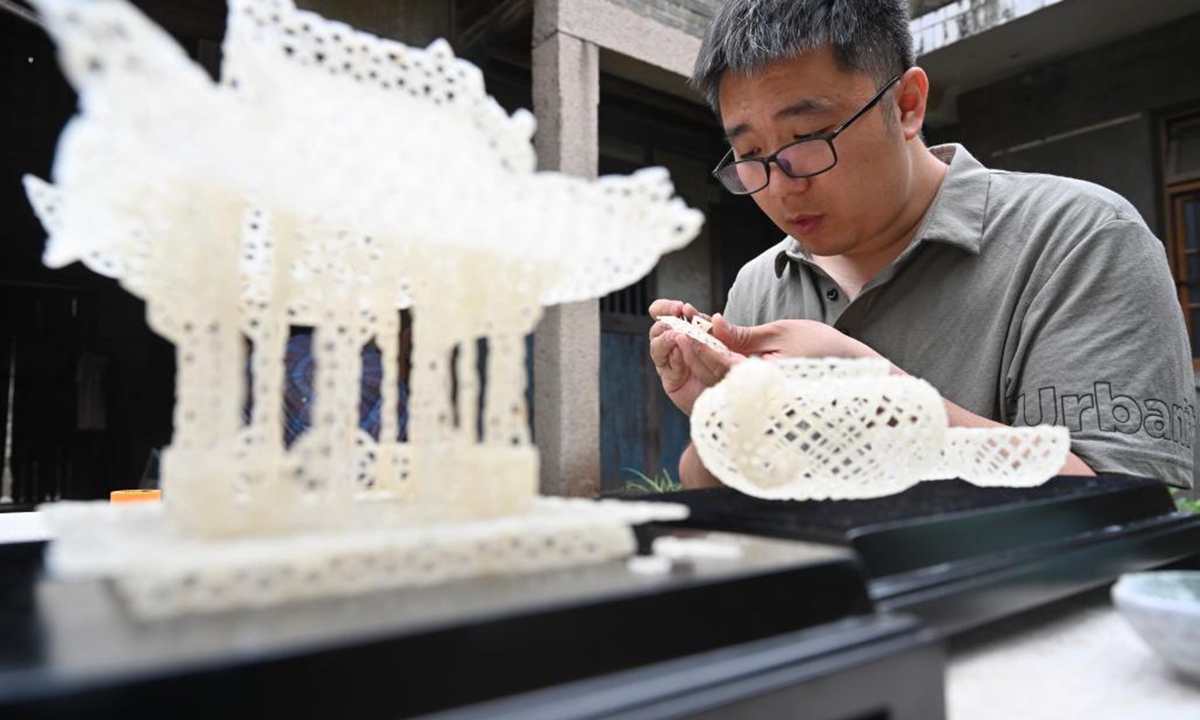 Chen Guorui makes a Gaolou rice craftwork in Gaolou Village, Fuzhou City of southeast China's Fujian Province, May 21, 2021. (Xinhua/Song Weiwei)