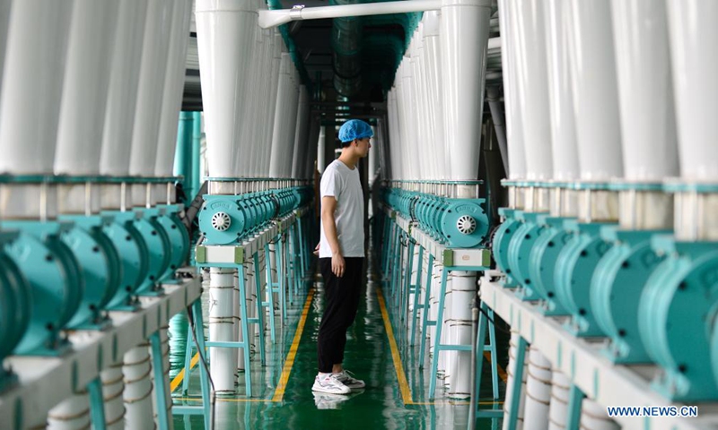 A staff member works on the production line of a local noodle factory in Xingtai, north China's Hebei Province, June 9, 2021. (Xinhua/Jin Haoyuan)