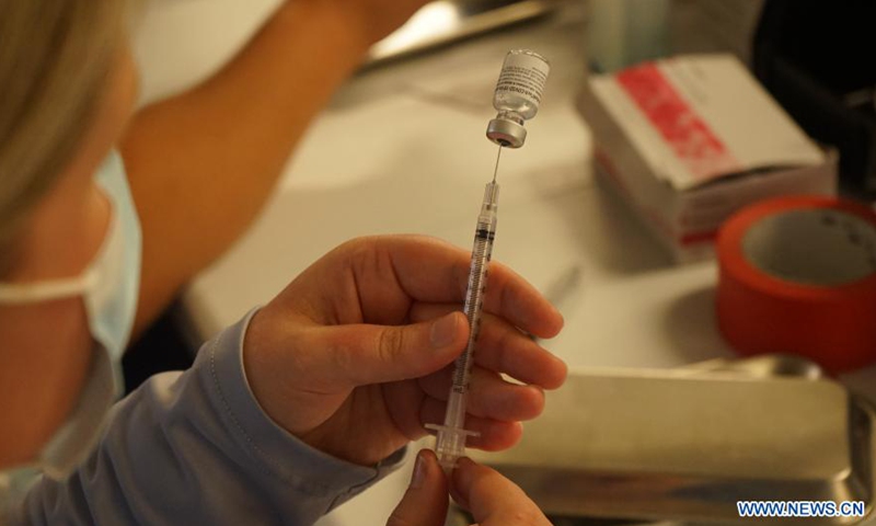 A medical worker prepares a dose of COVID-19 vaccine at the Universal Studios Hollywood in Los Angeles, California, the United States, June 18, 2021. California has launched a digital platform through which local residents could get access to their COVID-19 vaccine records.Photo:Xinhua