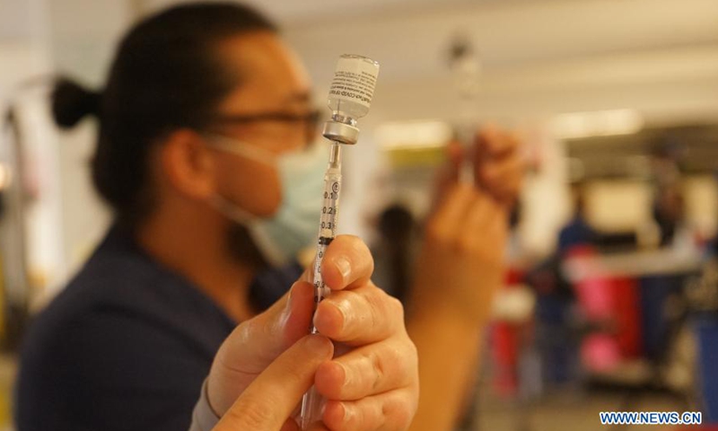 A medical worker prepares a dose of COVID-19 vaccine at the Universal Studios Hollywood in Los Angeles, California, the United States, June 18, 2021. California has launched a digital platform through which local residents could get access to their COVID-19 vaccine records.Photo:Xinhua