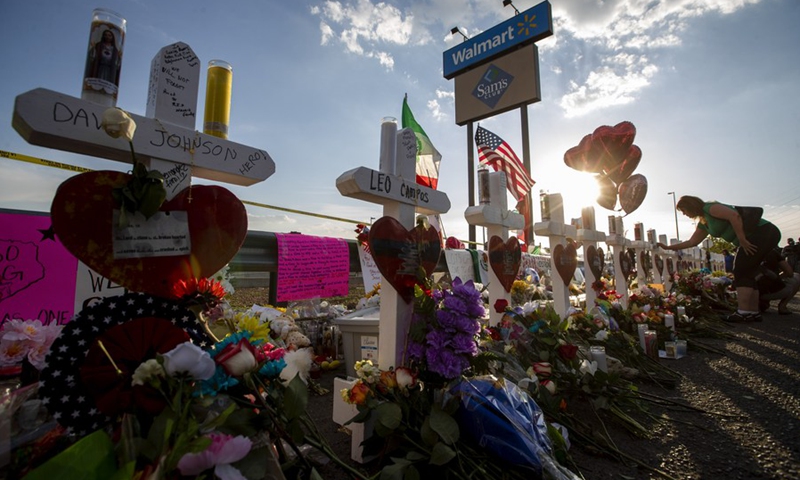 Crosses with names of victims are placed near the Walmart center where a massive shooting took place, in El Paso, Texas, the United States, Aug. 5, 2019.(Photo: Xinhua)