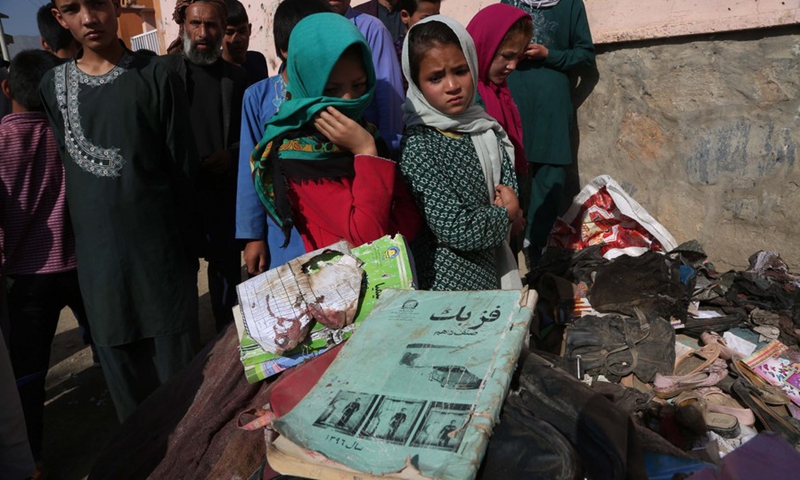 Photo taken on May 9, 2021 shows the books of students who were killed in a car bomb attack in Kabul, capital of Afghanistan.(Photo: Xinhua)