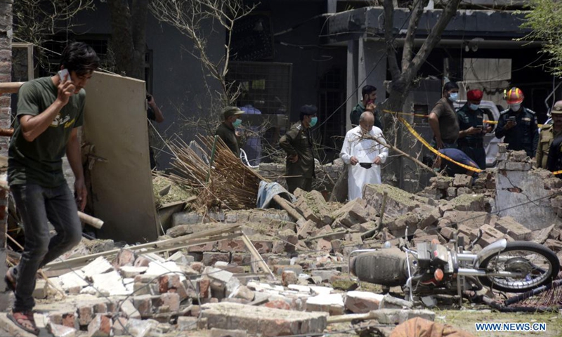 Security officials inspect the site of a blast in Lahore, Pakistan on June 23, 2021. A powerful explosion ripped through a residential area in Lahore, the capital city of Pakistan's eastern Punjab province, killing at least two people and injuring 15 others, an official said on Wednesday.(Photo: Xinhua)