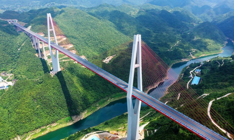 Aerial photo taken on June 26, 2021 shows the Xiangjiang River Grand Bridge along the Zunyi-Yuqing expressway in southwest China's Guizhou Province. The 93km expressway is expected to shorten the travel time between Zunyi City and Yuqing County from 3 hours to about 70 minutes.Photo:Xinhua