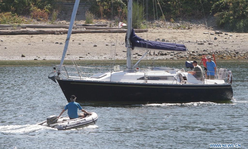 People drive their boats in waters at False Creek in Vancouver, British Columbia, Canada, on July 13, 2021. As the summer boating season ramps up and more new boaters are sharing the waterways, the Port of Vancouver reminds people it's critical time to follow the safety practices and measures to ensure everyone's safety on waterways.(Photo: Xinhua)