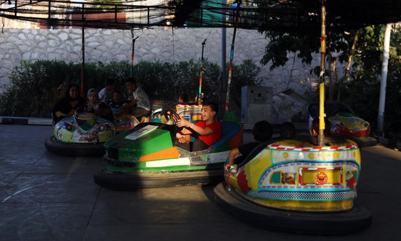 People enjoy themselves at a park during Eid al-Adha holiday in Qalyubia province, Egypt, on July 23, 2021.Photo:Xinhua