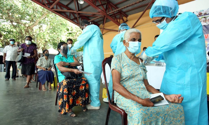 People receive COVID-19 vaccine at a vaccination center in Colombo, Sri Lanka, Aug. 1, 2021. Sri Lankan authorities on Sunday set up several vaccination centers across the Western Province which includes capital Colombo to administer the second doses of the AstraZeneca vaccines after over 700,000 doses arrived in the country on Saturday.(Photo: Xinhua)