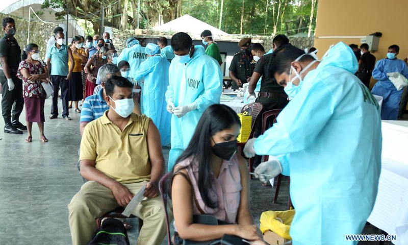 People receive COVID-19 vaccine at a vaccination center in Colombo, Sri Lanka, Aug. 1, 2021. Sri Lankan authorities on Sunday set up several vaccination centers across the Western Province which includes capital Colombo to administer the second doses of the AstraZeneca vaccines after over 700,000 doses arrived in the country on Saturday.(Photo: Xinhua)