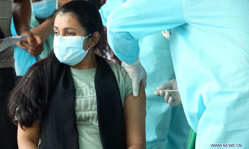 A woman receives a dose of COVID-19 vaccine at a vaccination center in Colombo, Sri Lanka, Aug. 1, 2021. Sri Lankan authorities on Sunday set up several vaccination centers across the Western Province which includes capital Colombo to administer the second doses of the AstraZeneca vaccines after over 700,000 doses arrived in the country on Saturday.(Photo: Xinhua)