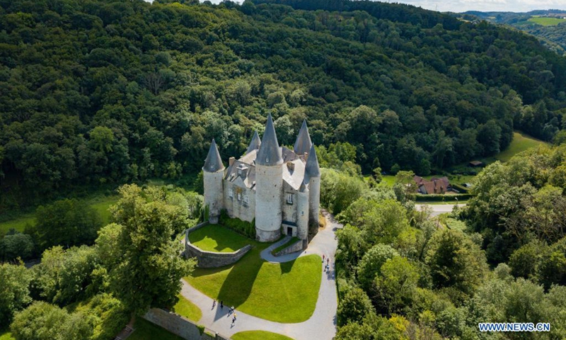 Aerial photo taken on Aug. 1, 2021 shows the Castle of Celles in Houyet, Belgium. The Castle of Celles, also known as the Castle de Veves, is one of the most remarkable specimens of 15th century military architecture. Destroyed in 1200 and rebuilt in 1230, the buildings burned down at the beginning of the 15th century and were restored after the fire. The castle remained a fortress until the end of the Middle Ages. (Photo: Xinhua)