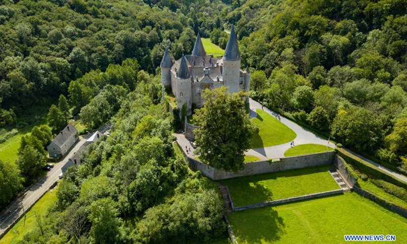 Aerial photo taken on Aug. 1, 2021 shows the Castle of Celles in Houyet, Belgium. The Castle of Celles, also known as the Castle de Veves, is one of the most remarkable specimens of 15th century military architecture. Destroyed in 1200 and rebuilt in 1230, the buildings burned down at the beginning of the 15th century and were restored after the fire. The castle remained a fortress until the end of the Middle Ages. (Photo: Xinhua)