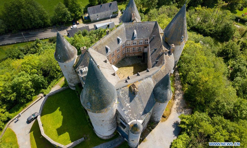 Aerial photo taken on Aug. 1, 2021 shows the Castle of Celles in Houyet, Belgium. The Castle of Celles, also known as the Castle de Veves, is one of the most remarkable specimens of 15th century military architecture. Destroyed in 1200 and rebuilt in 1230, the buildings burned down at the beginning of the 15th century and were restored after the fire. The castle remained a fortress until the end of the Middle Ages. (Photo: Xinhua)