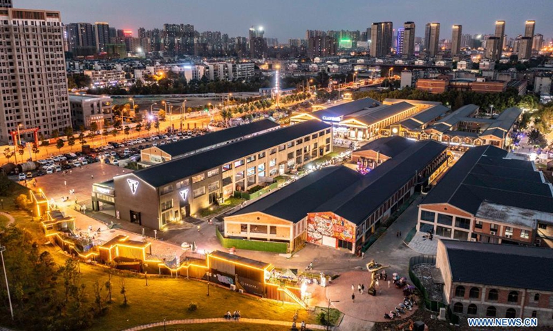 Aerial photo taken on Aug. 7, 2021 shows the night view of the Yangtze River 180 art district in Hefei City of east China's Anhui Province. Transformed from old factory buildings, the Yangtze River 180 art district is now a cultural and creative industry park, which provides the citizens with space for recreation.(Photo: Xinhua)