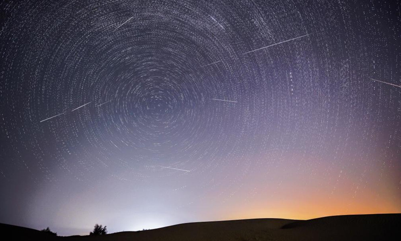 Photo taken on Aug. 13, 2021 shows the night sky during the Perseid Meteor Shower above an ecological demonstration zone of Engebei in Kubuqi Desert, north China's Inner Mongolia Autonomous Region.Photo:Xinhua