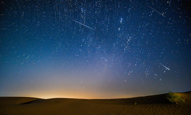 Photo taken on Aug. 13, 2021 shows the night sky during the Perseid Meteor Shower above an ecological demonstration zone of Engebei in Kubuqi Desert, north China's Inner Mongolia Autonomous Region.Photo:Xinhua