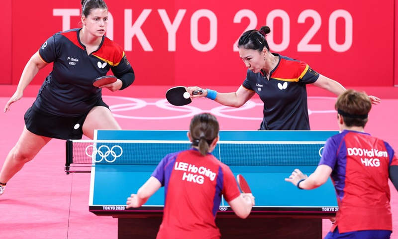 Petrissa Solja (L, rear) and Shan Xiaona (R, rear) of Germany compete against Doo and Lee during the table tennis women's team bronze medal match.(Photo: Xinhua)