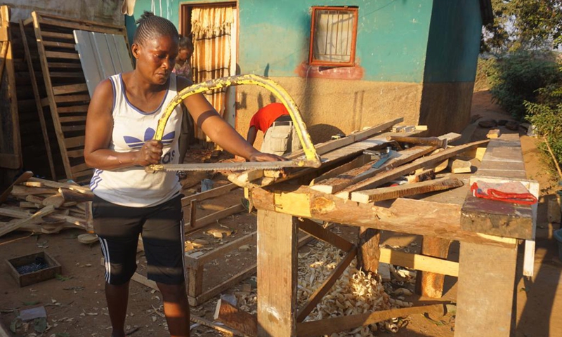 Beatrice Nanyangwe, a female carpenter, makes furniture in Ndola, capital of Copperbelt province, Zambia, on Aug. 7, 2021. Nanyangwe, who is based in Ndola's Chipulukusu compound, has been making a range of furniture pieces for over a year, something she embarked on after undergoing training in carpentry and joinery at a correctional facility few years ago in Lusaka, the Zambian capital.(Photo: Xinhua)