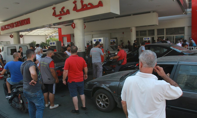 People wait to fill gasoline at a gas station in the city of Tripoli, northern Lebanon, on Aug. 12, 2021.(Photo: Xinhua)