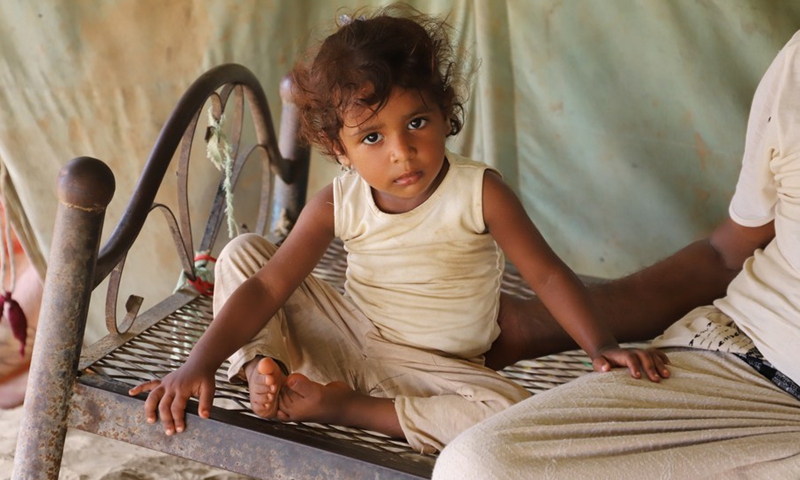 A girl sits on the bed in a remote village in Midi District, Hajjah Province, north Yemen on Aug. 14, 2021.(Photo: Xinhua)