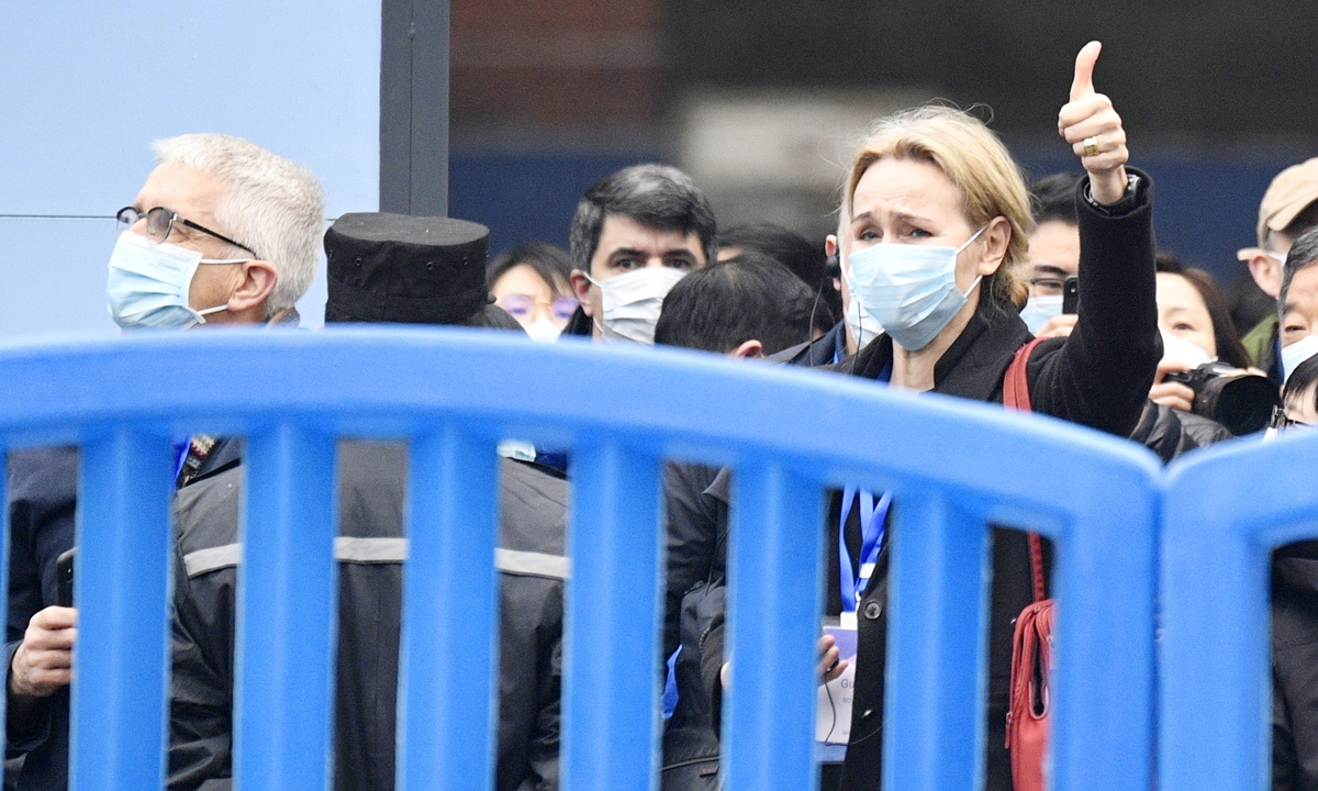 A member of the WHO-China joint team studying?the origins of the coronavirus gives a thumbs-up in front of cameras in Wuhan, Central China's Hubei Province, on January 31. Photo: IC

