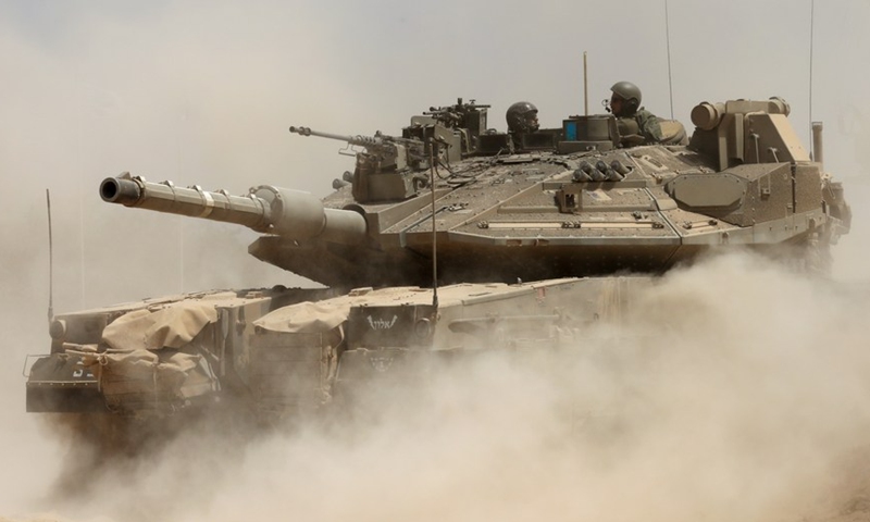 Israeli soldiers stand on their tanks as the troops patrol near the Israel-Gaza border on Aug. 25, 2021.(Photo: Xinhua)