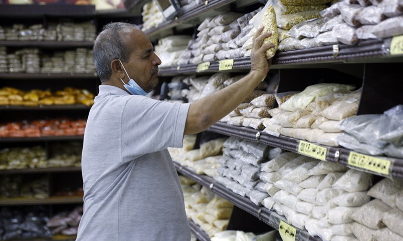 A Yemeni man buys food in a supermarket in Sanaa, Yemen on Aug. 24, 2021.(Photo: Xinhua)