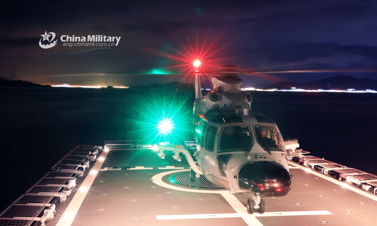 A ship-borne helicopter lifts off from the flight deck of the guided-missile frigate Shangrao (Hull 583) during a maritime training exercise held by a frigate flotilla with the navy under the PLA Eastern Theater Command in early August.Photo:China Military