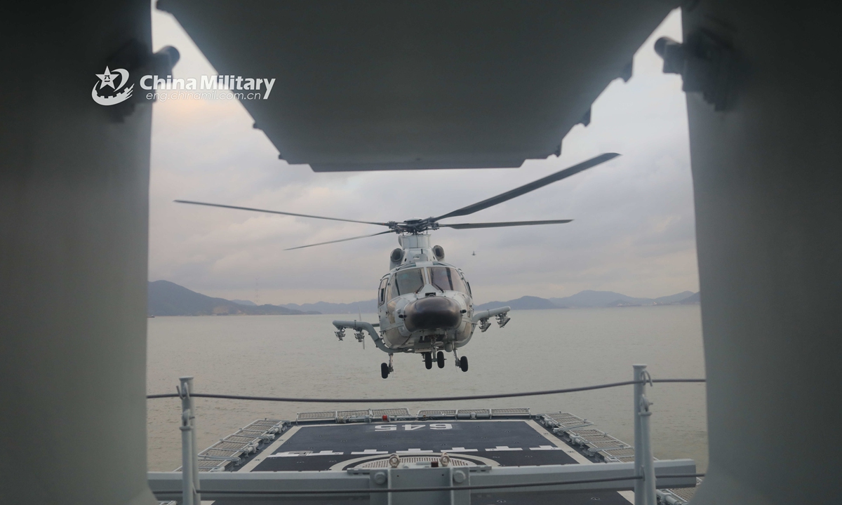 A ship-borne helicopter lifts off from the flight deck of a vessel during a maritime training exercise held by a frigate flotilla with the navy under the PLA Eastern Theater Command in early August. Photo:China Military