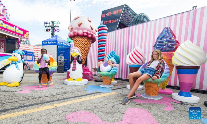 Children pose for photos with candy installations at the Sugar Rush theme park in Mississauga, Ontario, Canada, on Sept. 3, 2021. Photo:Xinhua