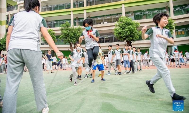 Students jump rope at a primary school in Wuhan, central China's Hubei Province, Sept. 1, 2021. Many elementary and middle schools in Wuhan began to provide different kinds of after-class services in order to meet students' individualized demands in the new semester.(Photo: Xinhua)