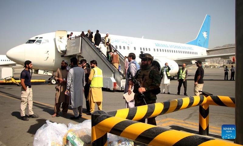 Passengers board a plane at the airport in Kabul, capital of Afghanistan, Sept. 6, 2021. Afghanistan's flag carrier airline Ariana Afghan Airlines has resumed domestic flights, a local television channel reported Sunday.(Photo: Xinhua)