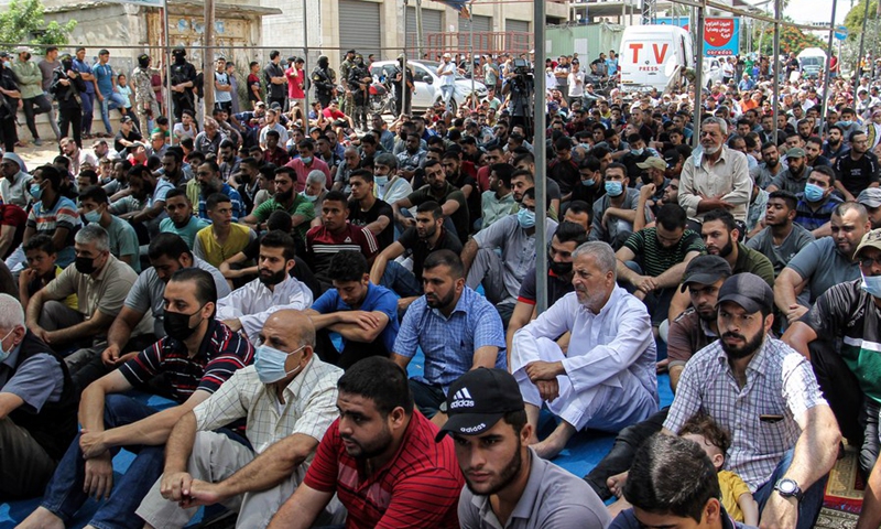 Palestinians attend Friday prayers in front of the Red Cross building in Gaza City on Sept. 10, 2021, to protest the Israeli tightened measures against Palestinian prisoners in Israeli jails following a prison break by six Palestinian prisoners.(Photo: Xinhua)