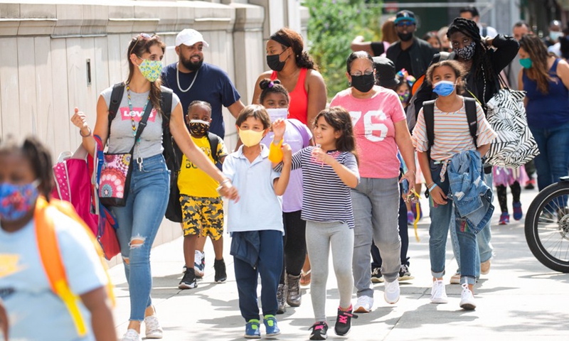 Students are dismissed from the first day of school at PS 133 in the Brooklyn borough of New York, the United States, on Sept. 13, 2021.(Photo: Xinhua)