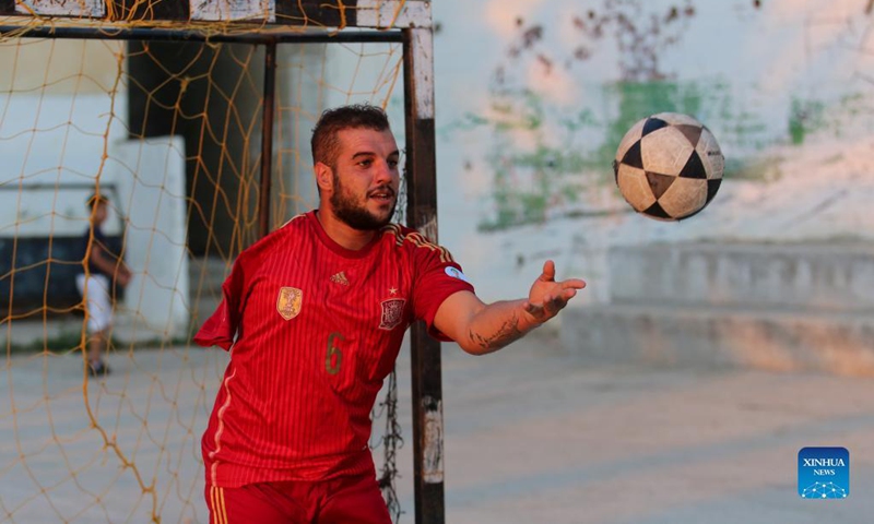 Oday Nasser trains at a small stadium in Deir Sharaf village in the West Bank city of Nablus, on Sept. 15, 2021. Without an arm, Oday Nasser has become an outstanding goalkeeper known across the West Bank, who managed to win dozens of medals in the local football league.(Photo: Xinhua)