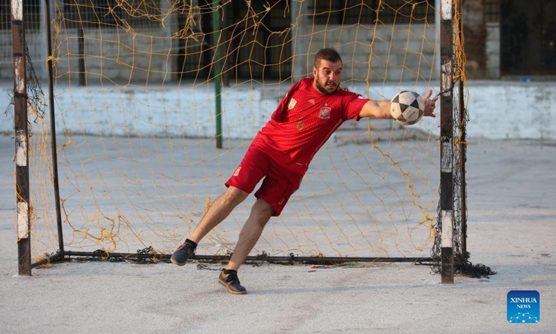 Oday Nasser trains at a small stadium in Deir Sharaf village in the West Bank city of Nablus, on Sept. 15, 2021. Without an arm, Oday Nasser has become an outstanding goalkeeper known across the West Bank, who managed to win dozens of medals in the local football league.(Photo: Xinhua)